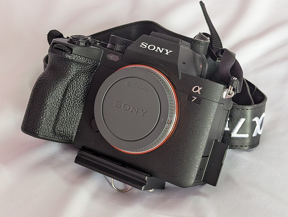 Sony α7 IV mirrorless camera body, front three-quarter view